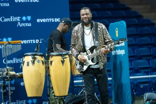 A guitarist performing at stage